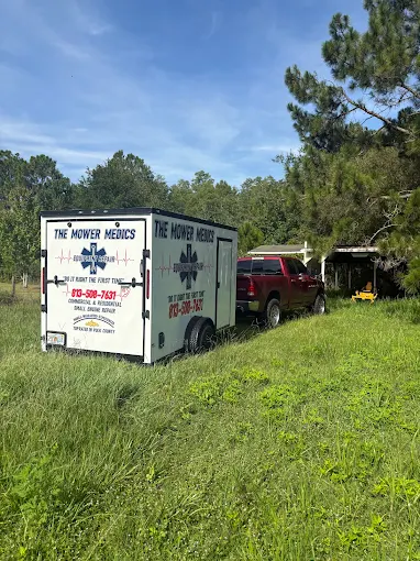 The Mower Medics mobile mechanic trailer parked on site for a small engine repair job